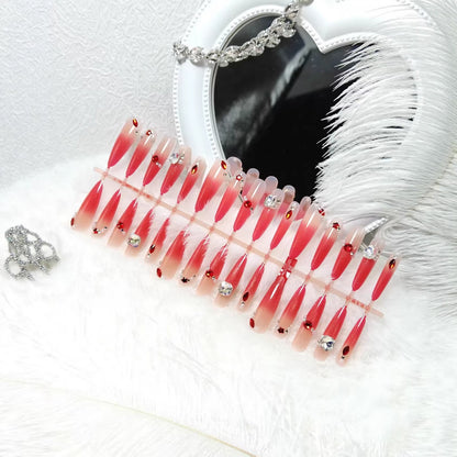 Artificial nails with glamorous glitter and rhinestone embellishments Acalora