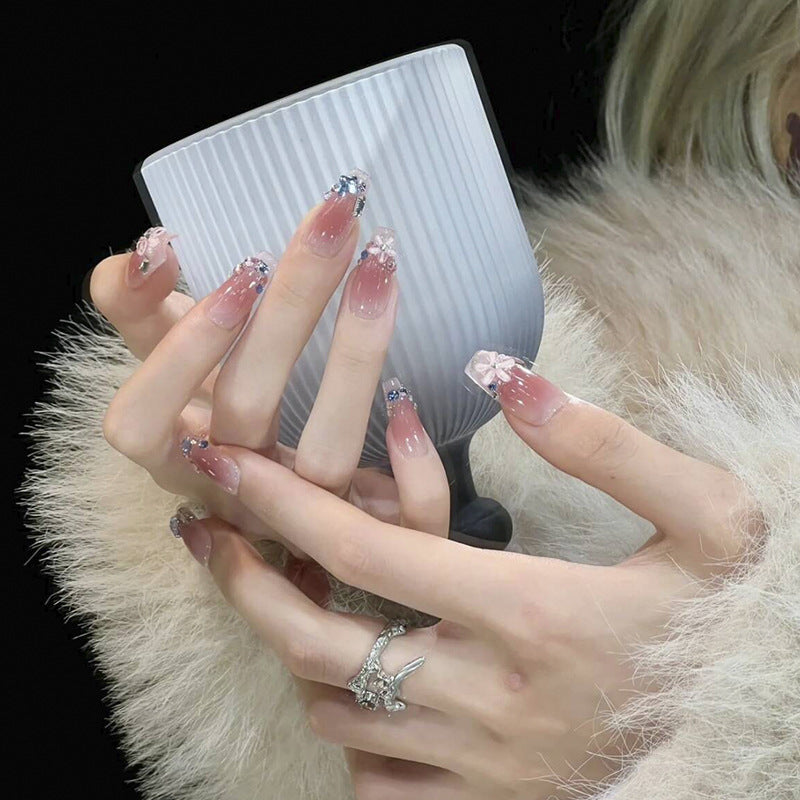 Artificial nail set with glamorous 3D decorations and shimmering accents Acalora