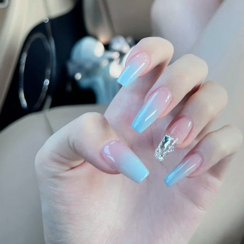 Nail set with elegant ombre and glitter accents Acalora