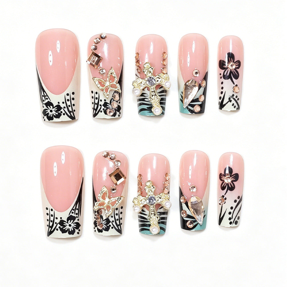 Artistic Stiletto Nail Design with Floral Accents and Gems Acalora