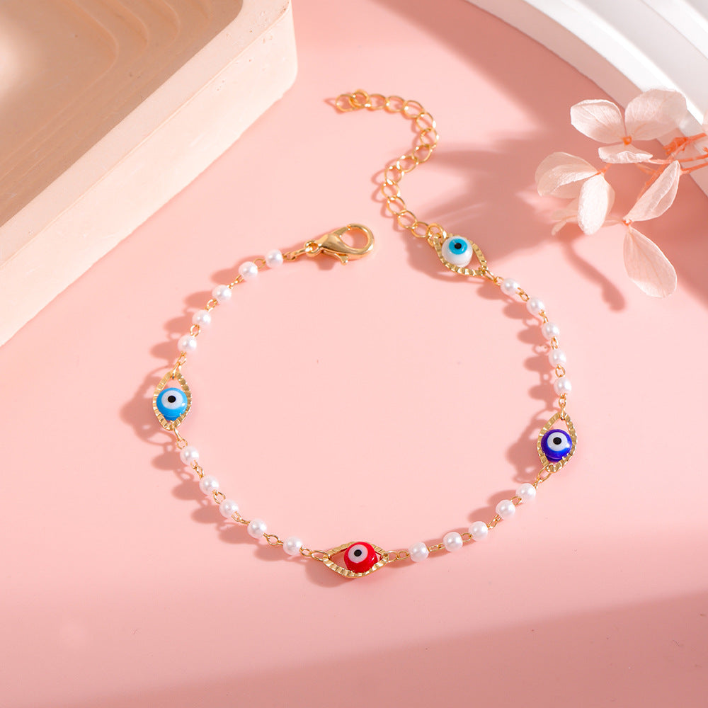 Elegant Pearl and Eye Charm Necklace Acalora