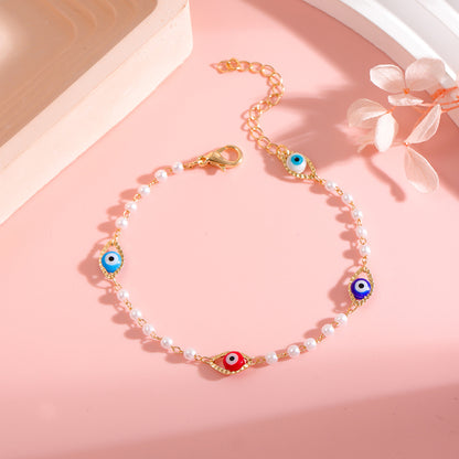 Elegant Pearl and Eye Charm Necklace Acalora