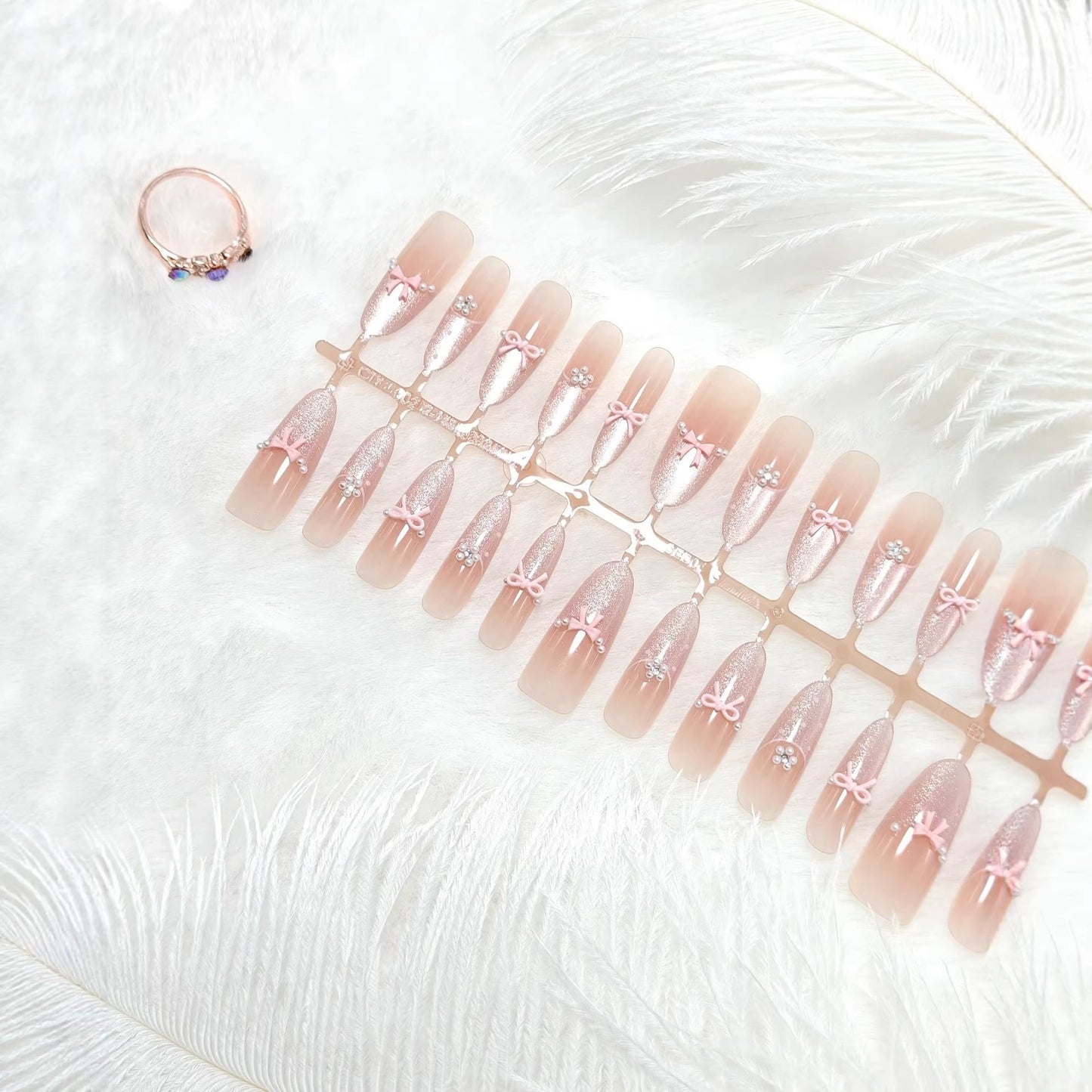 Artificial nails with elegant glitter and bow design Acalora