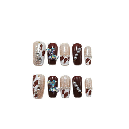 Artificial nails with glamorous 3D applications and glitter Acalora