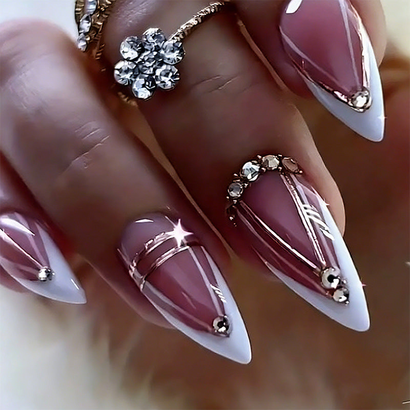 Acrylic nail set with elegant stiletto shape and luxurious embellishments Acalora