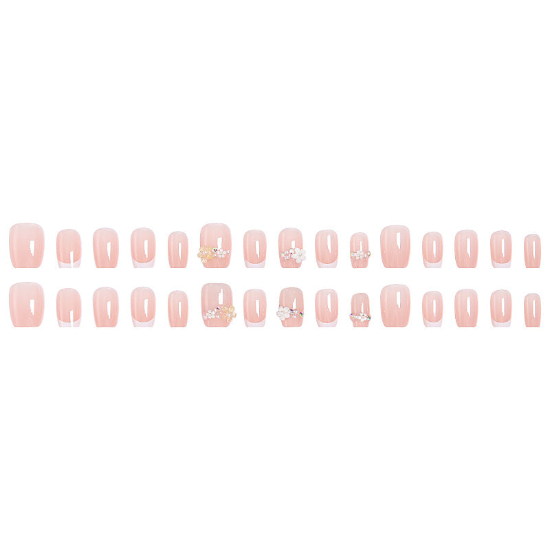 Nail set with elegant flower appliqués and exquisite glitter embellishments Acalora