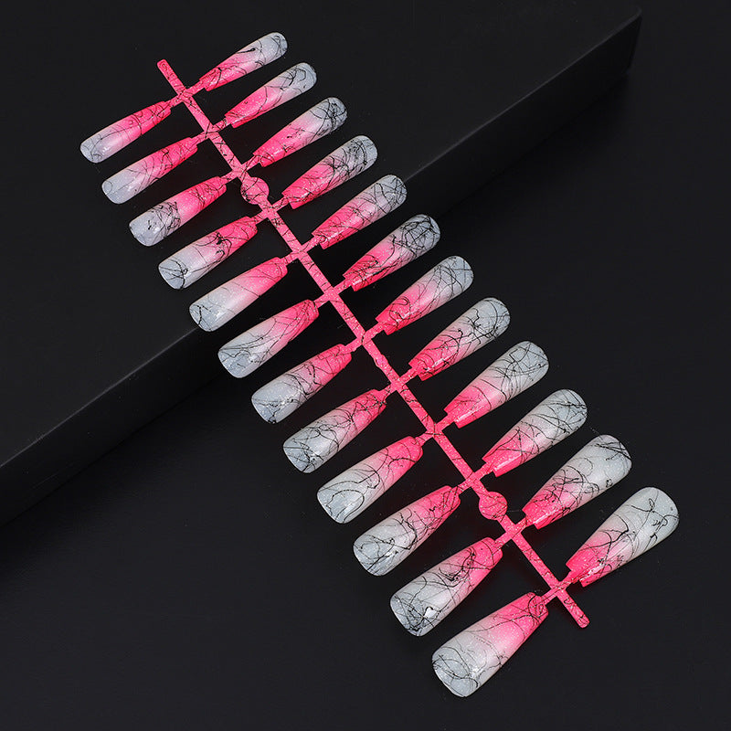 Artificial nails in modern ombre design with marbled accents Acalora