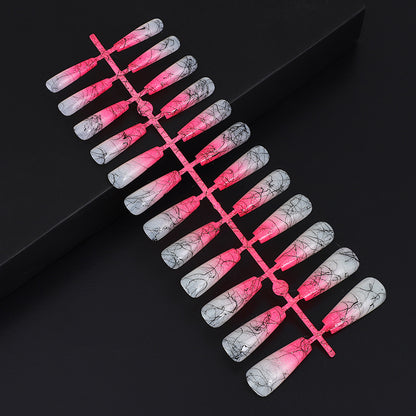 Artificial nails in modern ombre design with marbled accents Acalora