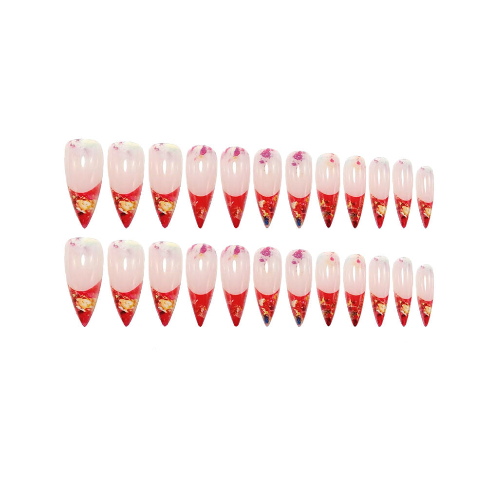 Nail art with sparkling design and extravagant pointed tips Acalora