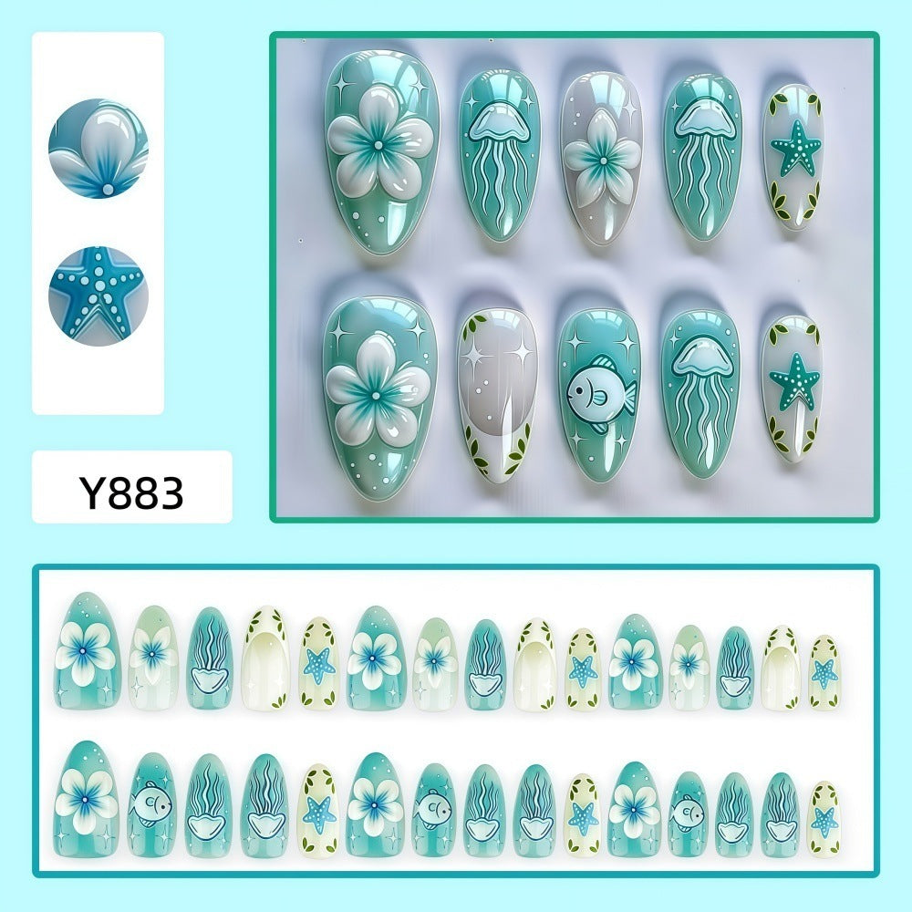 Artificial nails in a maritime design with colorful shell and water motifs Acalora