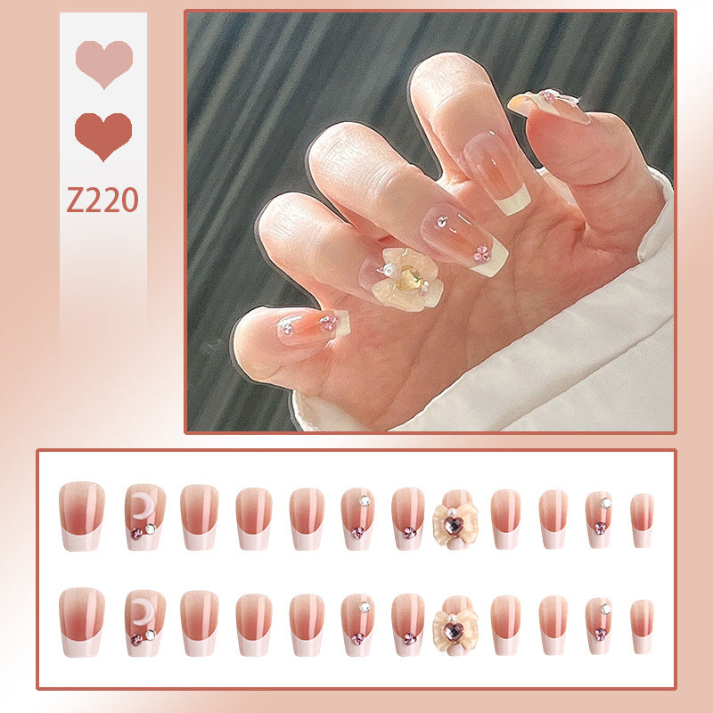 Artificial nail set with elegant floral decorations and glitter accents Acalora