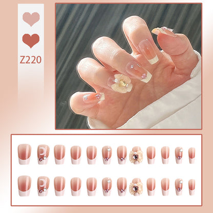 Artificial nail set with elegant floral decorations and glitter accents Acalora