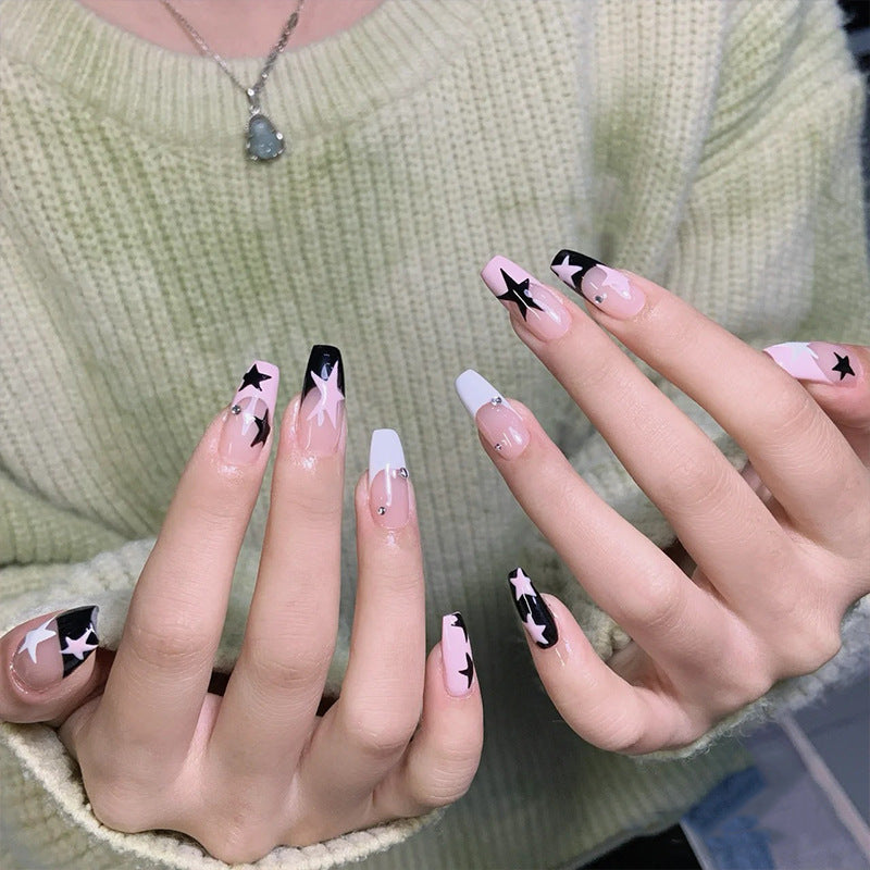 Artificial nail set with glamorous star design and sparkling accents Acalora