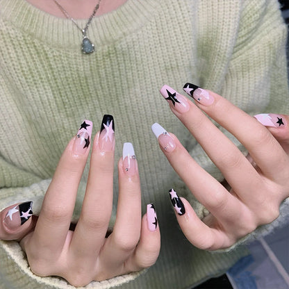 Artificial nail set with glamorous star design and sparkling accents Acalora