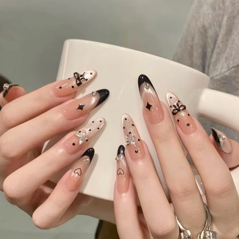 Nail art set with elegant black and white design and sparkling applications Acalora