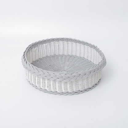 Handwoven storage basket with decorative edge