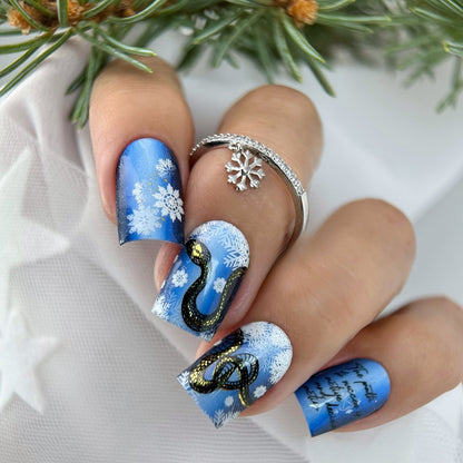 Creative art nails with snowflake and snake motif Acalora