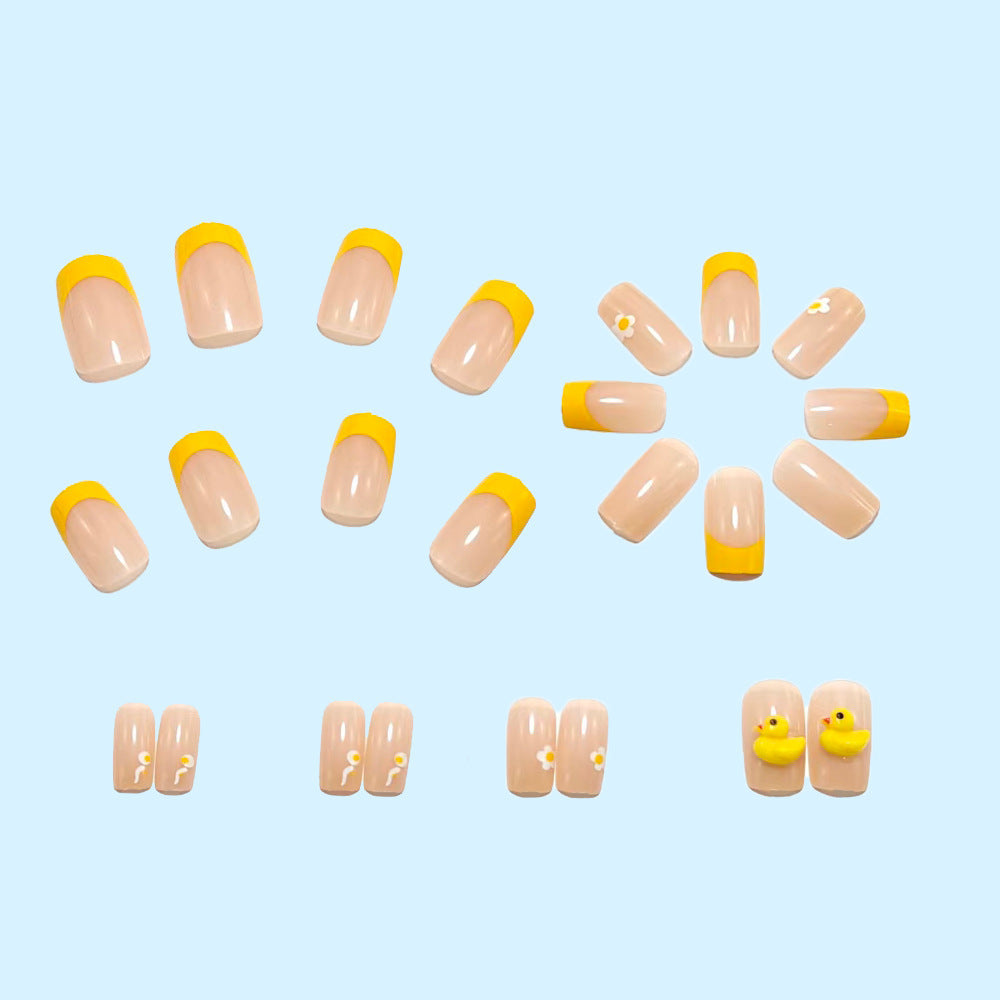 Artificial nails with playful duck motif and spring accents Acalora