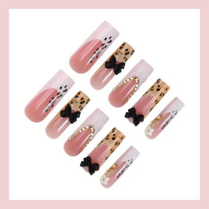 Artistic Press-On Nail Design with Bow and Animal Print Accents Acalora