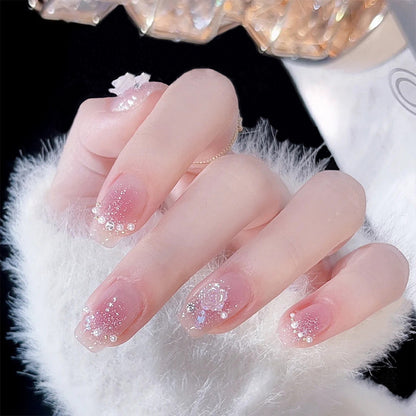 Artificial nail set with sparkling glitter and pearl decorations Acalora