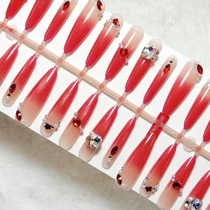 Artificial nails with glamorous glitter and rhinestone embellishments Acalora