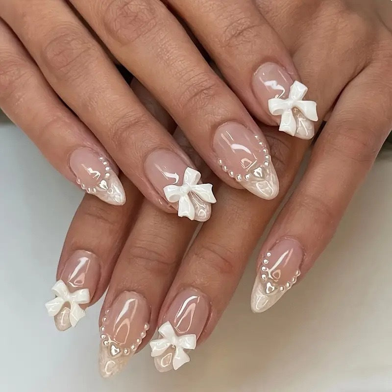 Artistic Press-On Nail Design with Bow Accents Acalora