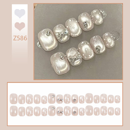 Artificial nail set with elegant glitter and crystal decorations Acalora