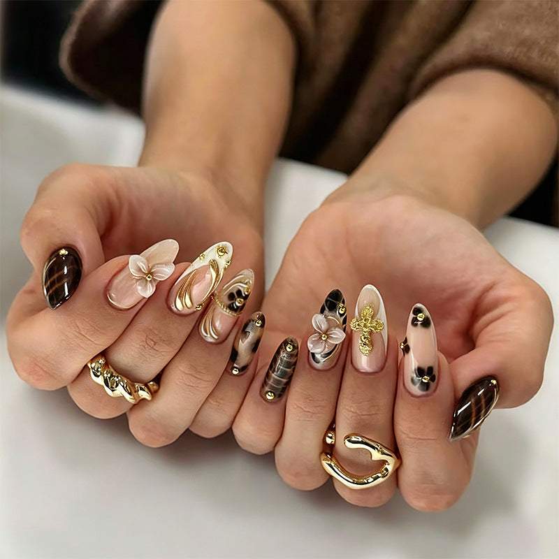 Artificial nail set with glamorous floral designs and creative glitter accents Acalora