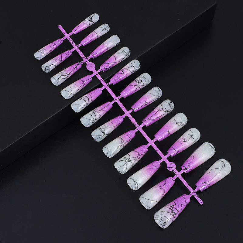 Artificial nails in modern ombre design with marbled accents Acalora
