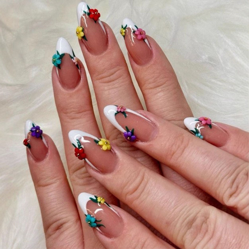 Artificial nails in a playful flower design with glittering accents Acalora