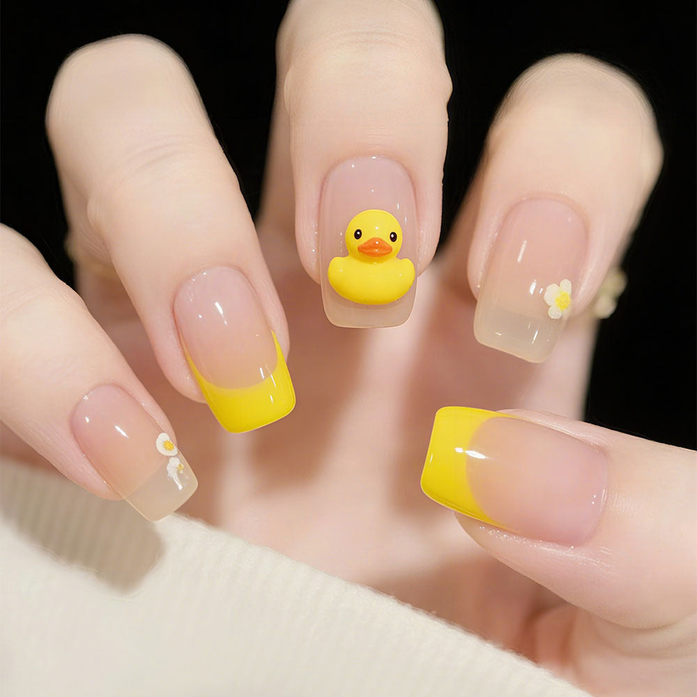 Artificial nails with playful duck motif and spring accents Acalora
