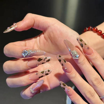 Glamorous artificial nail set with fun leopard pattern and glittering accents Acalora