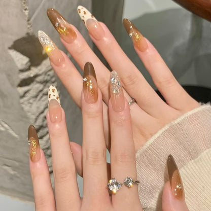 Glamorous artificial nails with creative embellishments Acalora