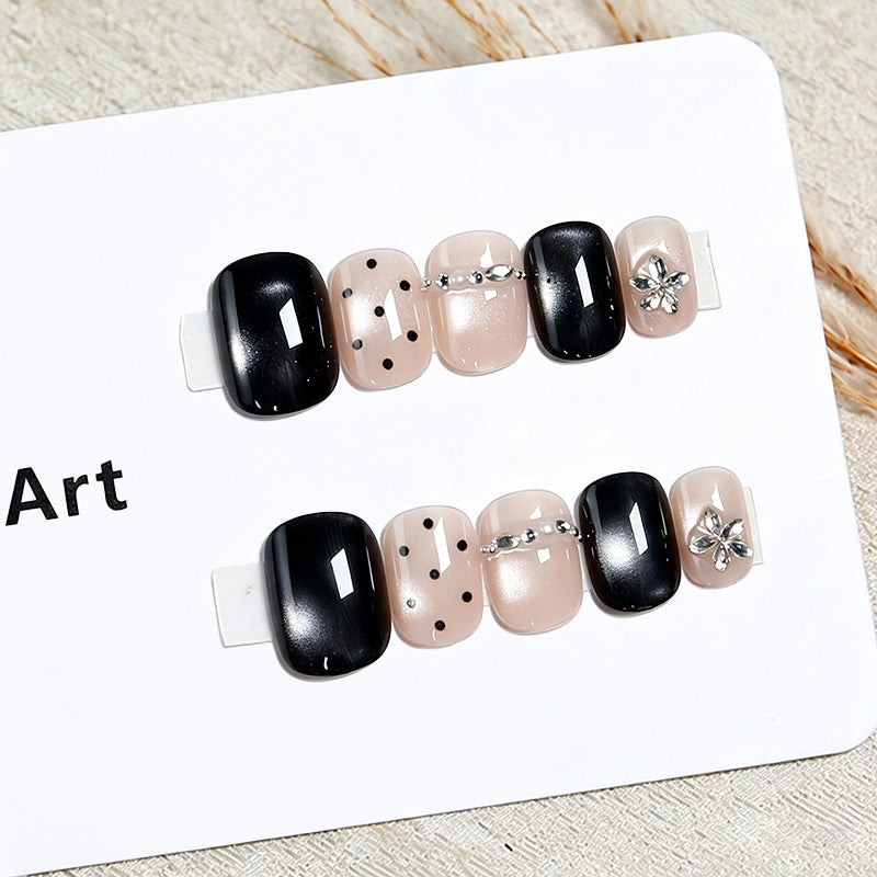 Acrylic nail set with glamorous accents and delicate designs Acalora
