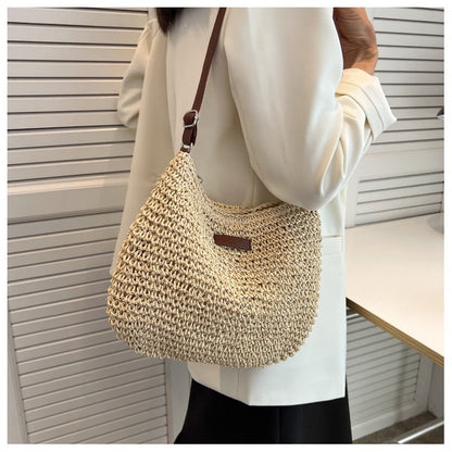 Handwoven shoulder bag with brown leather accent Skanto
