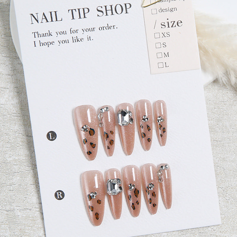 Glamorous artificial nail set with fun leopard pattern and glittering accents Acalora