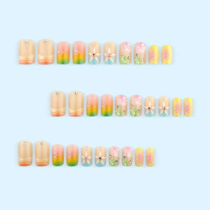Artificial nails in vibrant floral design with glitter accents Acalora