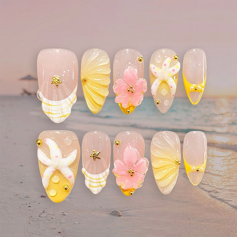 Artificial nail set with glamorous floral designs and creative glitter accents Acalora