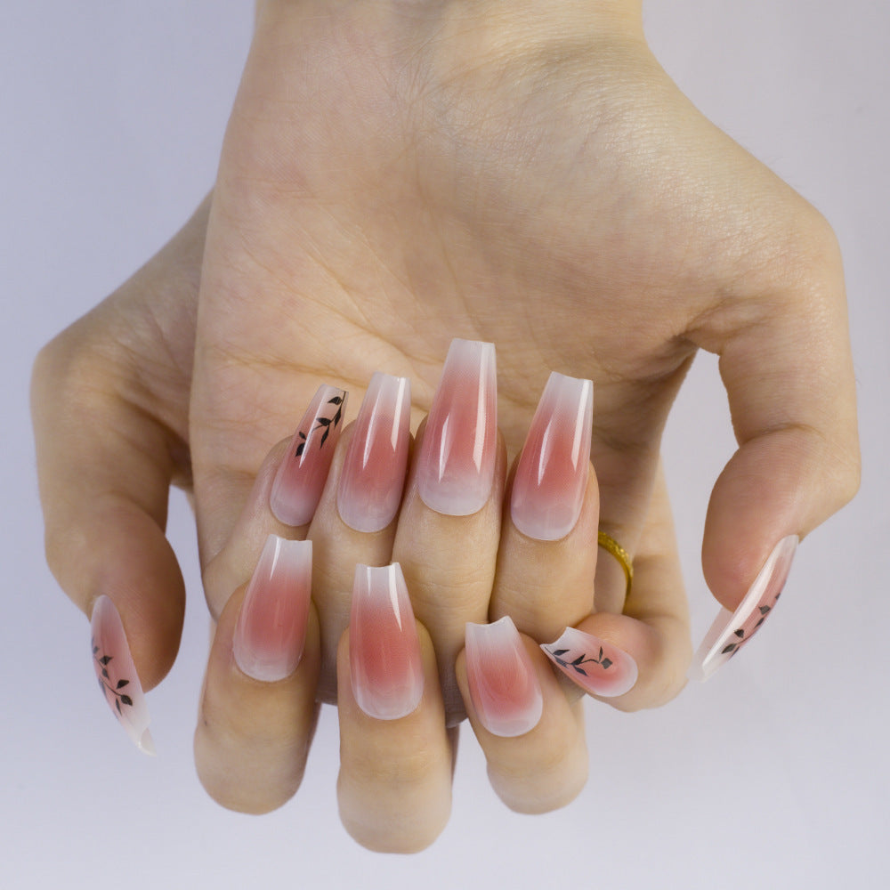 Press-on nails in elegant ombre design with floral accents Acalora