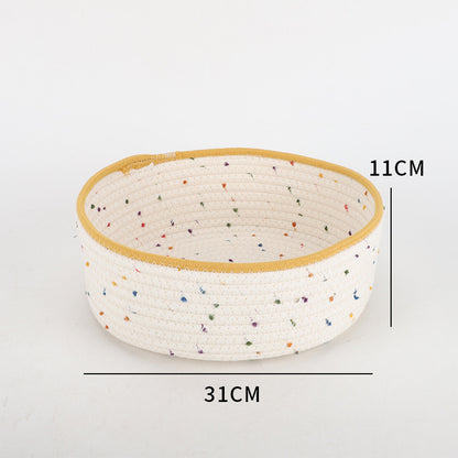 Storage basket made of natural cotton fabric with colorful dots