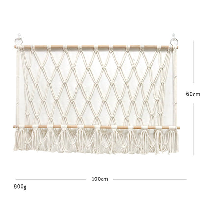 Elegant macramé wall hanging with decorative tassels and wooden frame
