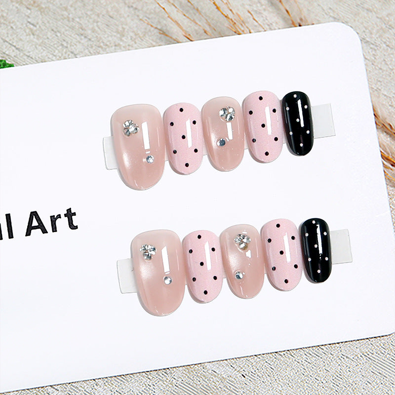 Acrylic nail set with glamorous rhinestone accents and modern dots Acalora