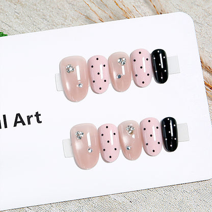 Acrylic nail set with glamorous rhinestone accents and modern dots Acalora