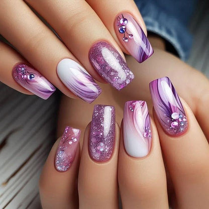 Artificial nails in a playful flower design with glittering accents Acalora