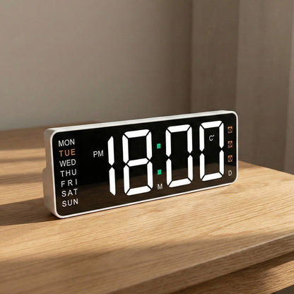 Digital wall clock with temperature and weekday display