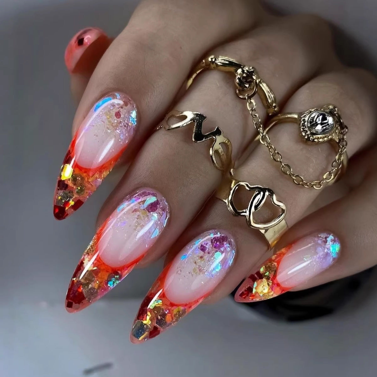 Nail art with sparkling design and extravagant pointed tips Acalora