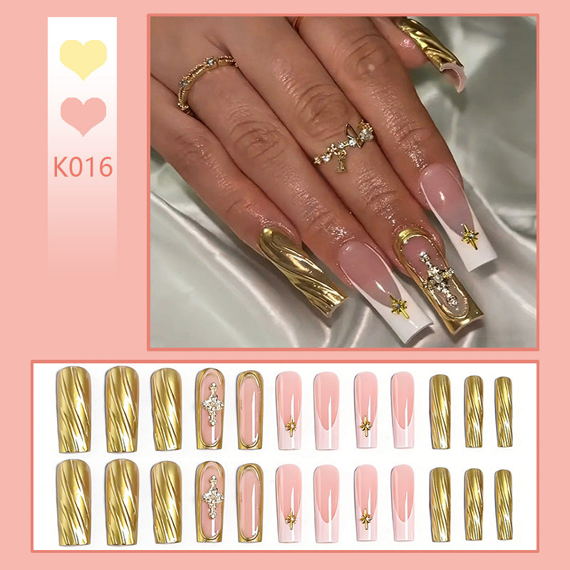Acrylic nail set with elegant golden embellishments and glamorous accents Acalora