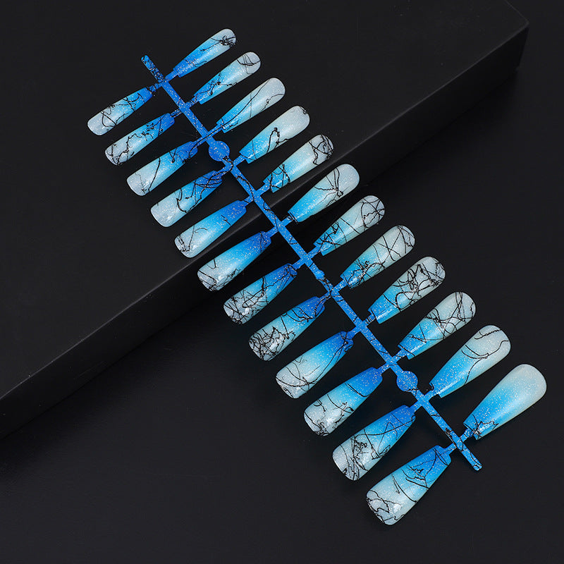 Artificial nails in modern ombre design with marbled accents Acalora