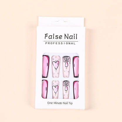 Eye-catching artificial nails with soulful heart design and glamorous accents Acalora