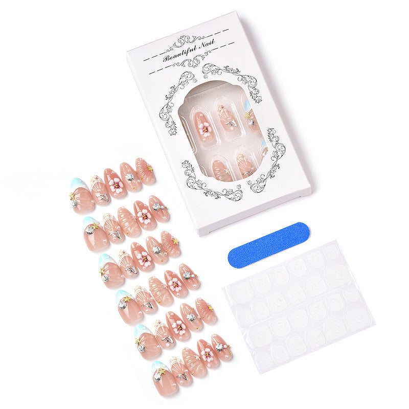 Acrylic nail set with filigree shell and flower decorations Acalora